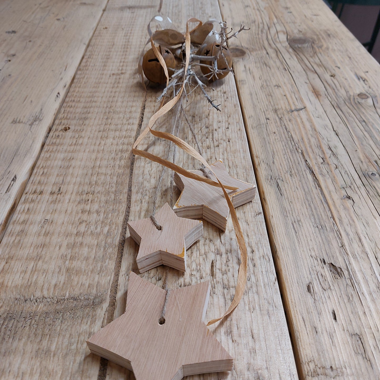 Handmade rustic door hanger with stars and bells