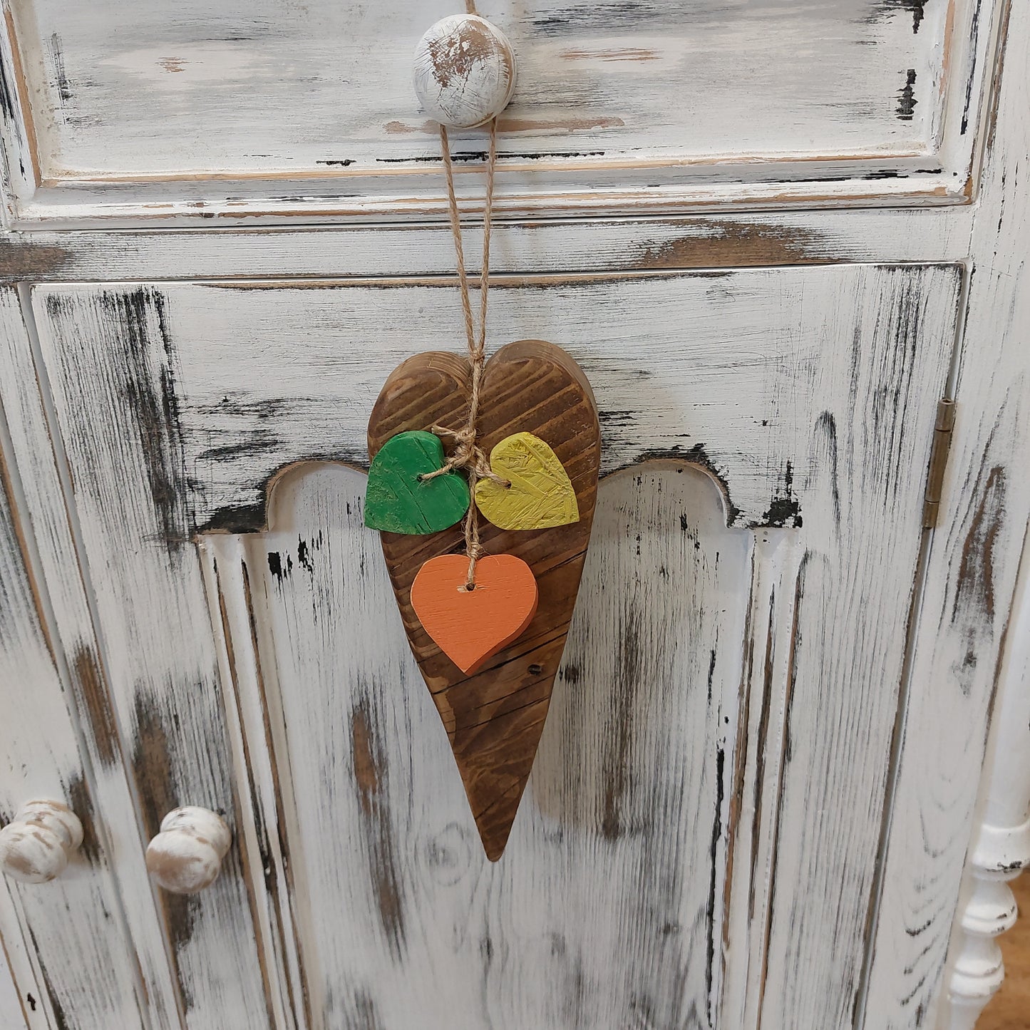 Chunky heart door hanger with 3 hearts in yellow green and orange solid wood